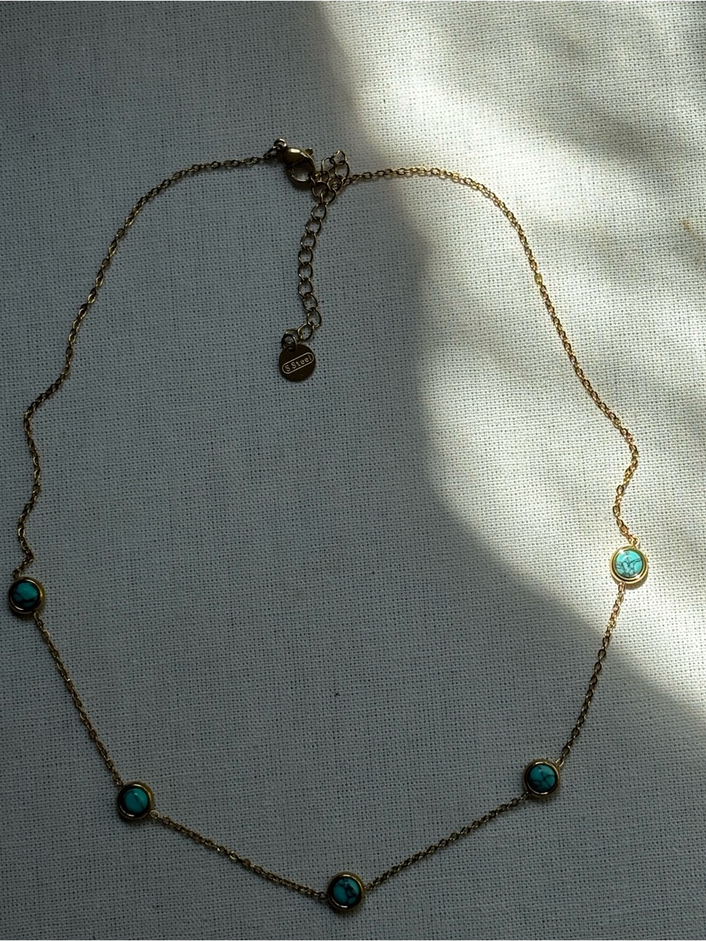 Gold Station Necklace with Turquoise Discs. Gold plated stainless steel